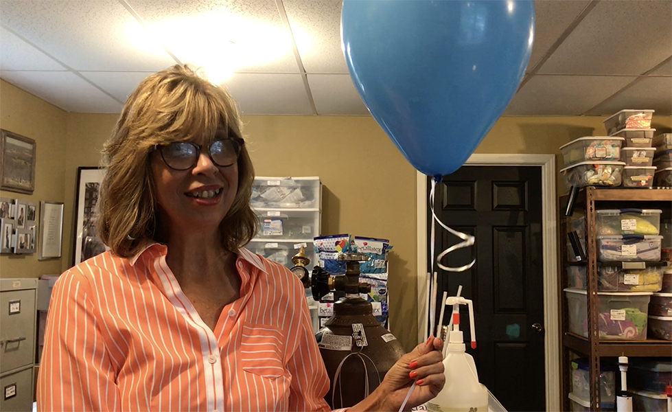 Peggy Williams Demonstrates How to Inflate a Latex Balloon